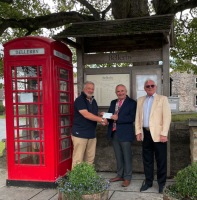 Richmond Rotary President Jos Huddleston (centre) presenting a cheque for £400 to John Hutchinson, Chairman of Bellerby Council (left) with Rotary organiser David Stewart.